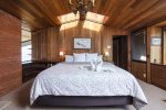 The master bedroom offers lots of natural lighting with skylights and windows offering views of the ocean and atrium